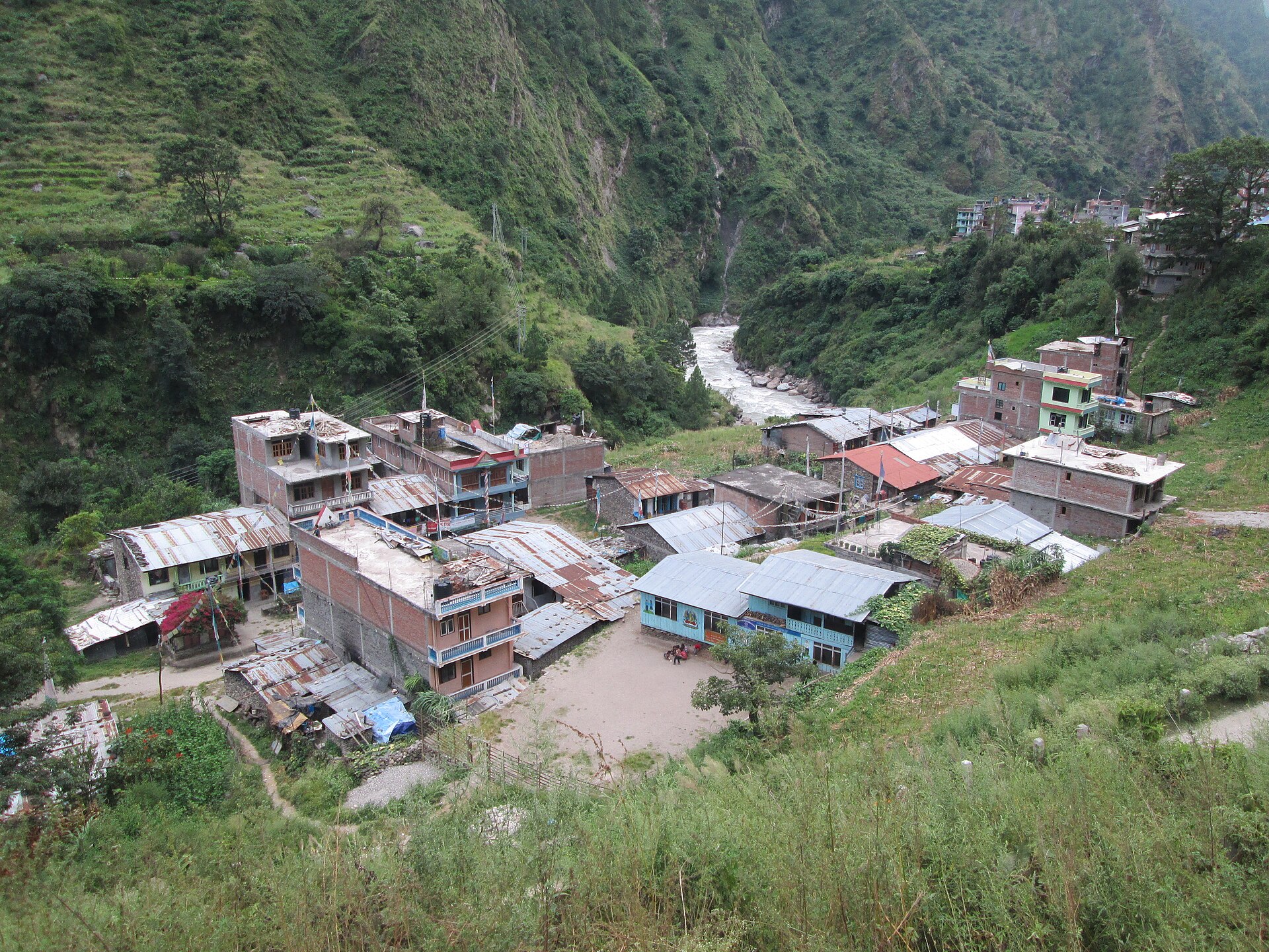 Syabrubesi village in Rasuwa district, Nepal, its houses and lodges built along the bank of the Bhote Koshi river in a steep forested valley